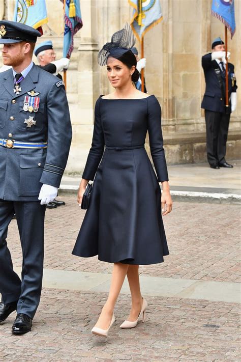 Meghan Markle wears a black Dior dress as she 